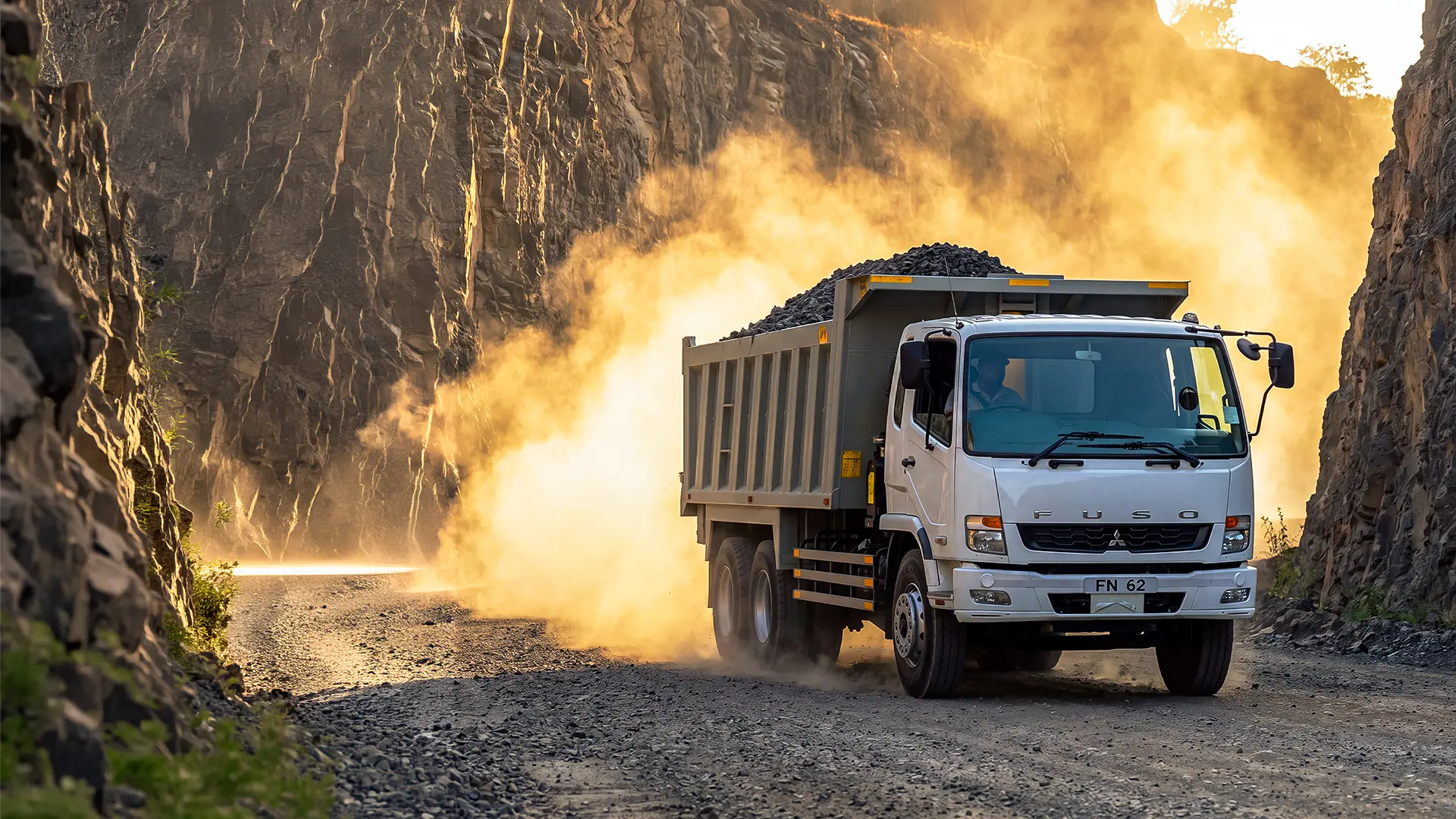 FUSO FN 62 6x4 tipper loaded with ballast climbing out of a Kenyan quarry